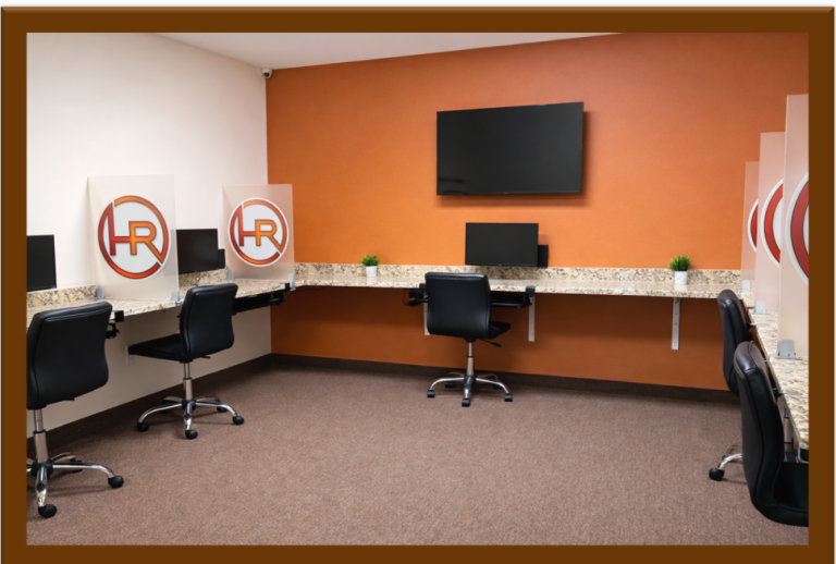 Professional testing center room at EverythingHR Talent Development Institute with multiple ergonomic workstations and privacy dividers
